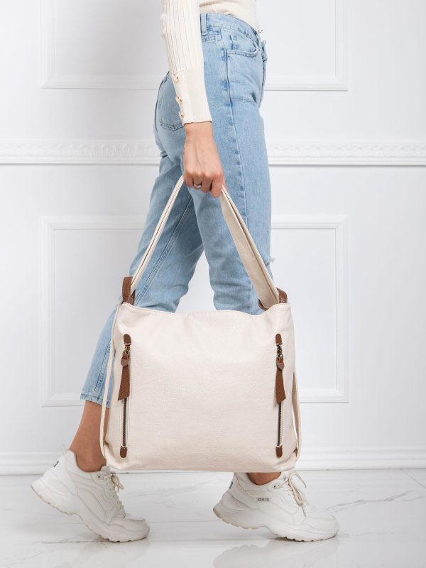 Jasnobeżowa torebka z paskiem