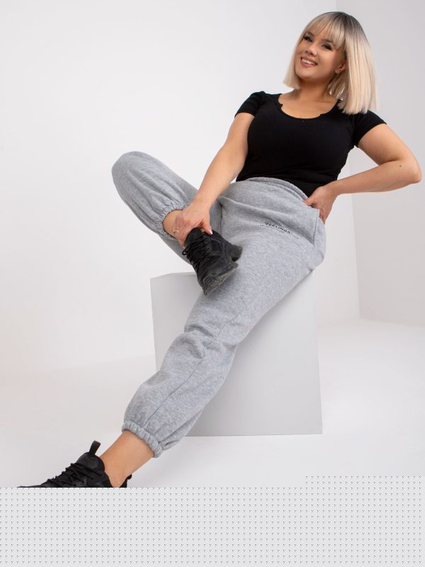 Hurtownia Szare melanżowe dresowe spodnie plus size z kieszeniami Banni